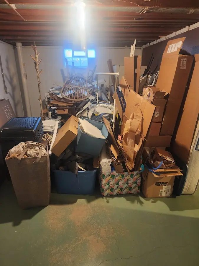 Roll-off dumpster container at job site for 20 Yard Dumpster Rental in Sutton